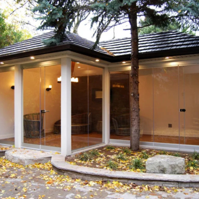 Glass pool cabana built by Cedar Wood Structures