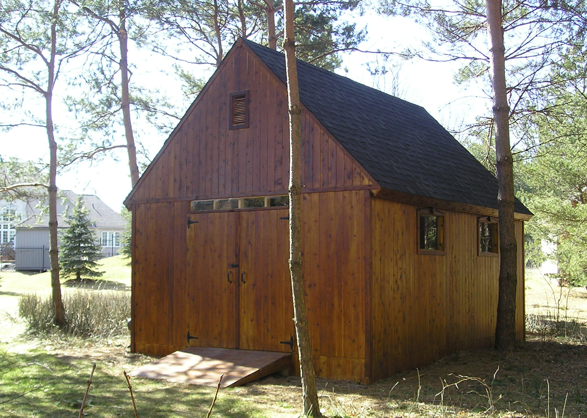 Stained cedar outbuilding with a gable roof