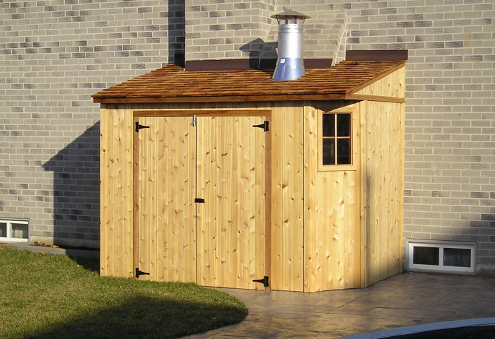 Cedar lean-to shed against a brick house wall